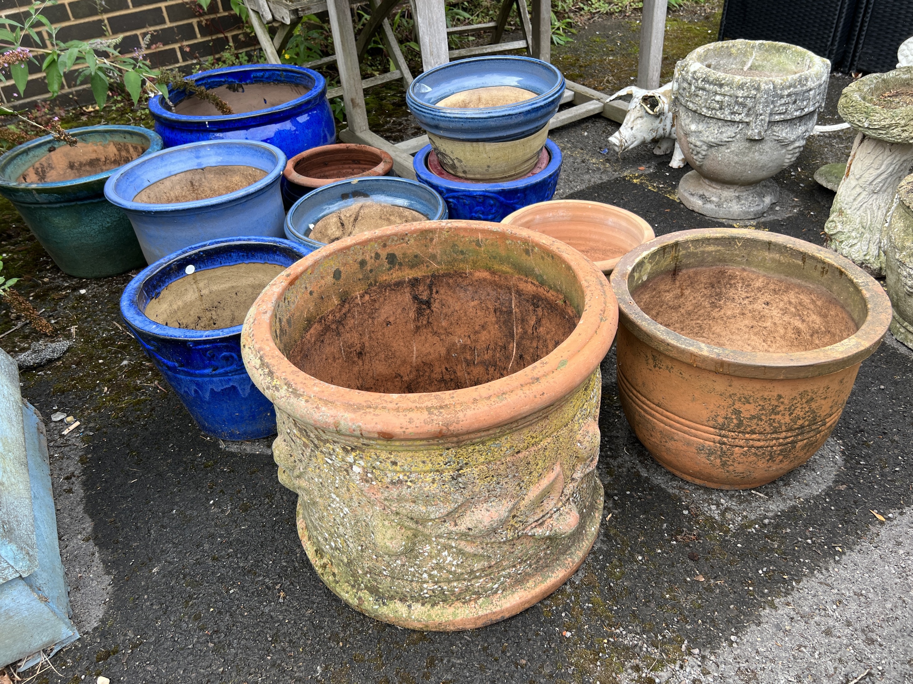 Twelve assorted earthenware garden planters, largest diameter 50cm, height 32cm